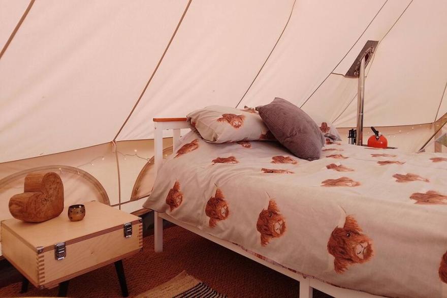 Luxury couples emperor bell tent, with log burner
