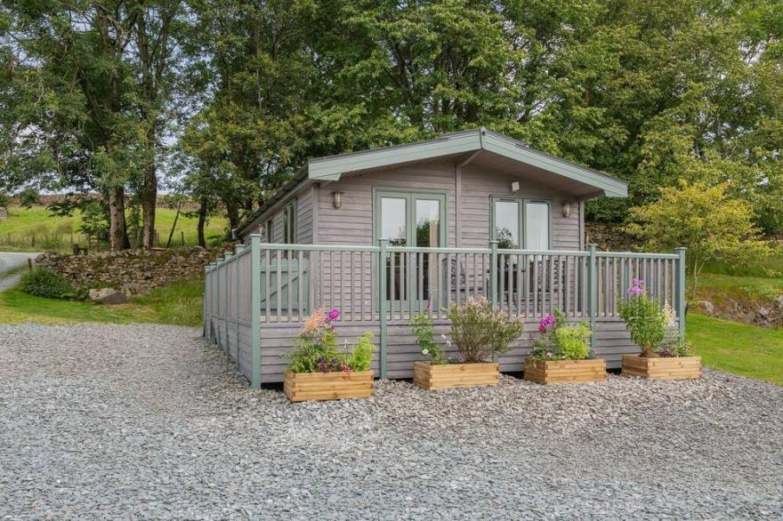 Spinney Lodge - a holiday lodge that sleeps 2 with an en-suite