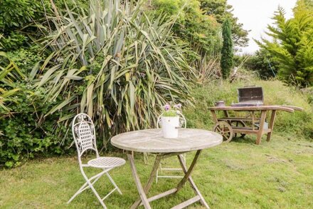 THE OLD DAIRY, character holiday cottage, with a garden in Millbrook