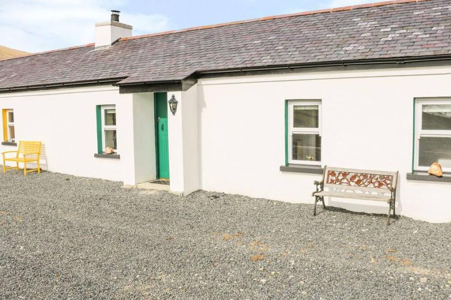 PAT WHITE'S COTTAGE, pet friendly, with open fire in Rostrevor