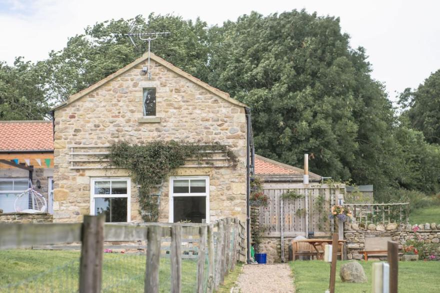 Once the old calf-house, this charming semi-detached traditional Yorkshire stone barn conversion is
