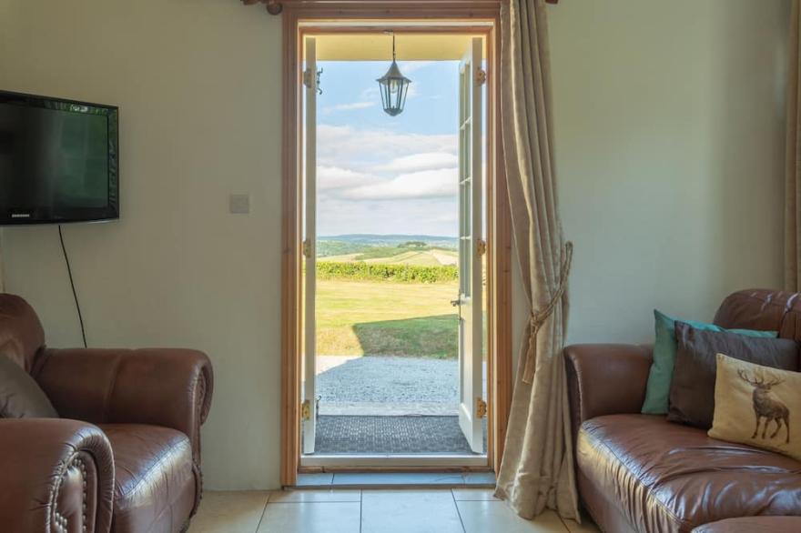 The Lodge Overlooks Rolling Countryside, Exe Estuary and the sea beyond.