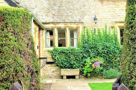 A Quaint Grade 11 Listed Detached Stone Cottage In Lower Slaughter with parking.