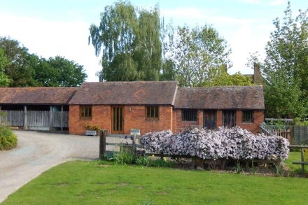 Sunny Cottage over-looking part of a Large Garden, in rural surroundings.