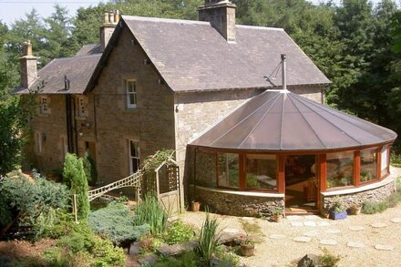 Large country house with outdoor hot tub and BBQ house and lovely gardens.