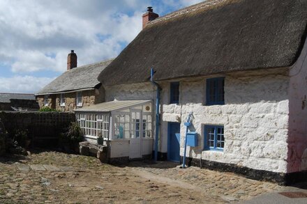 Thatched Cottage With Sea Views Situated Just Yards From The Beach