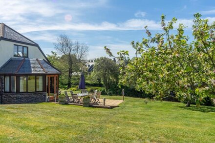 Overlooking the lakes of Roserrow, April Cottage is in an enviable location.