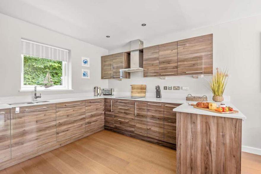 Stylish and contemporary pet friendly property featuring a wood-burning stove, patio hot tub and lar