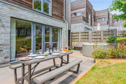 Stylish and contemporary pet friendly property featuring a wood-burning stove, patio hot tub and lar