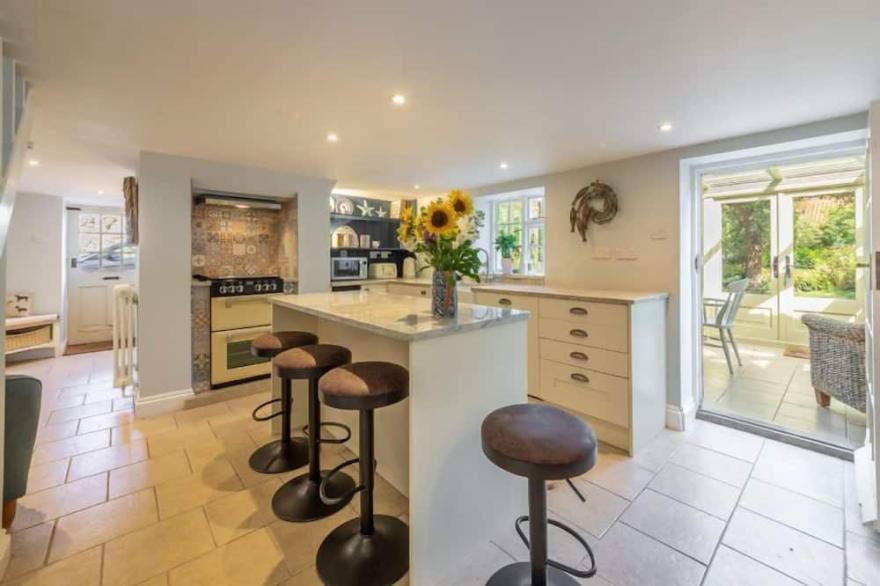 This wonderful retreat sleeps six and comes with a fabulous garden.