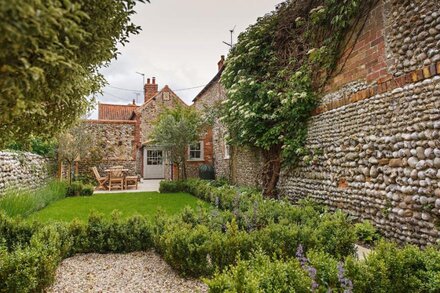 A traditional brick and flint cottage tucked away in the heart of Blakney