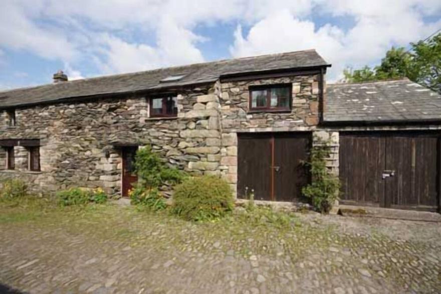 Traditional 17th century Lakeland stone barn between lakes Haweswater and Ullswater