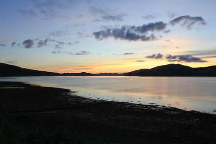 Traditional whitewashed fisherman's cottage overlooking Loch Fyne