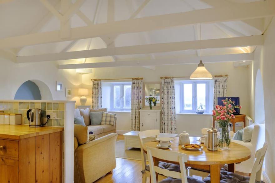 Wonderful reverse level conversion located on the sea front in picturesque rural hamlet on the South