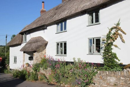 A stunning, one bedroomed, beamed thatched cottage in the village of Stockland.