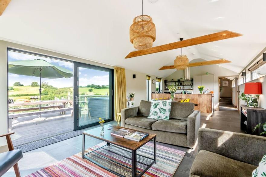 A stylish former milking parlour with outstanding rural views of Dorset.