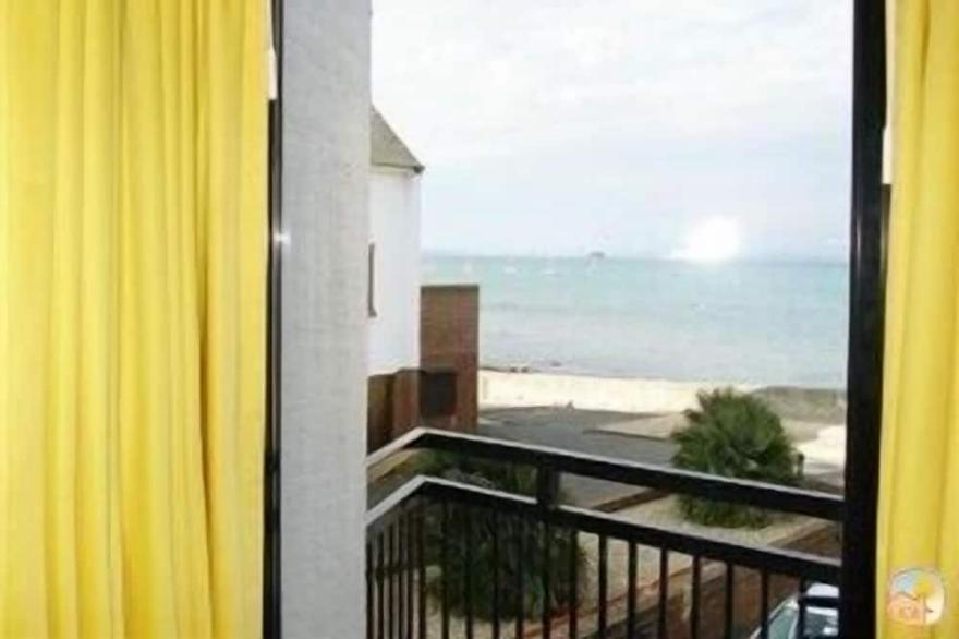 Charming seafront  home with garden on the Beach in unspoilt Seaside Village