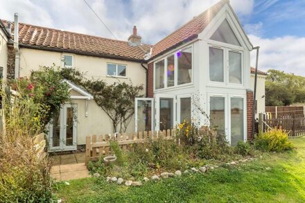 A pretty mid terrace cottage, bursting with charm and set in a peaceful location